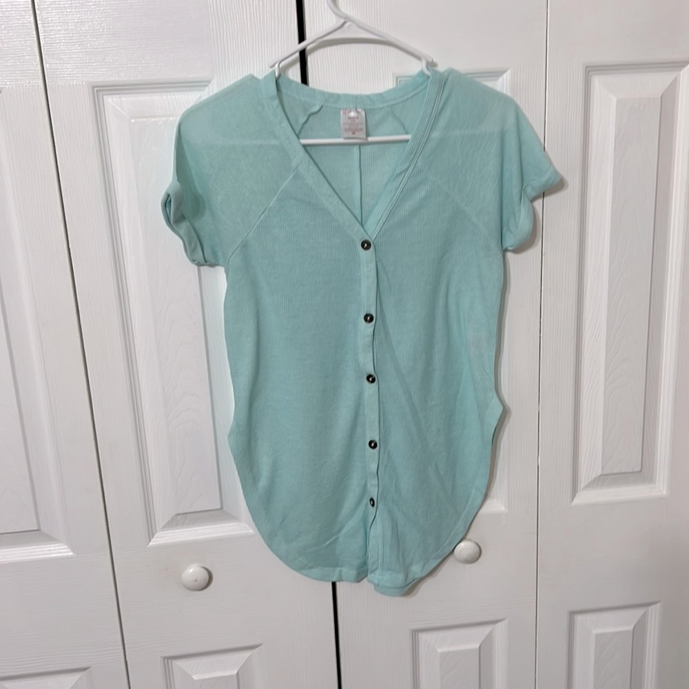 Light blue button down shirt with high side slits